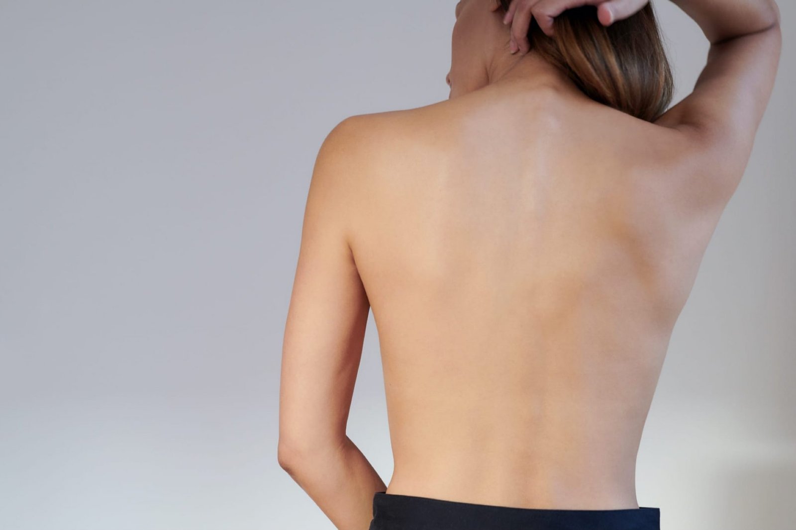 woman's bare back promoting bodytite treatment